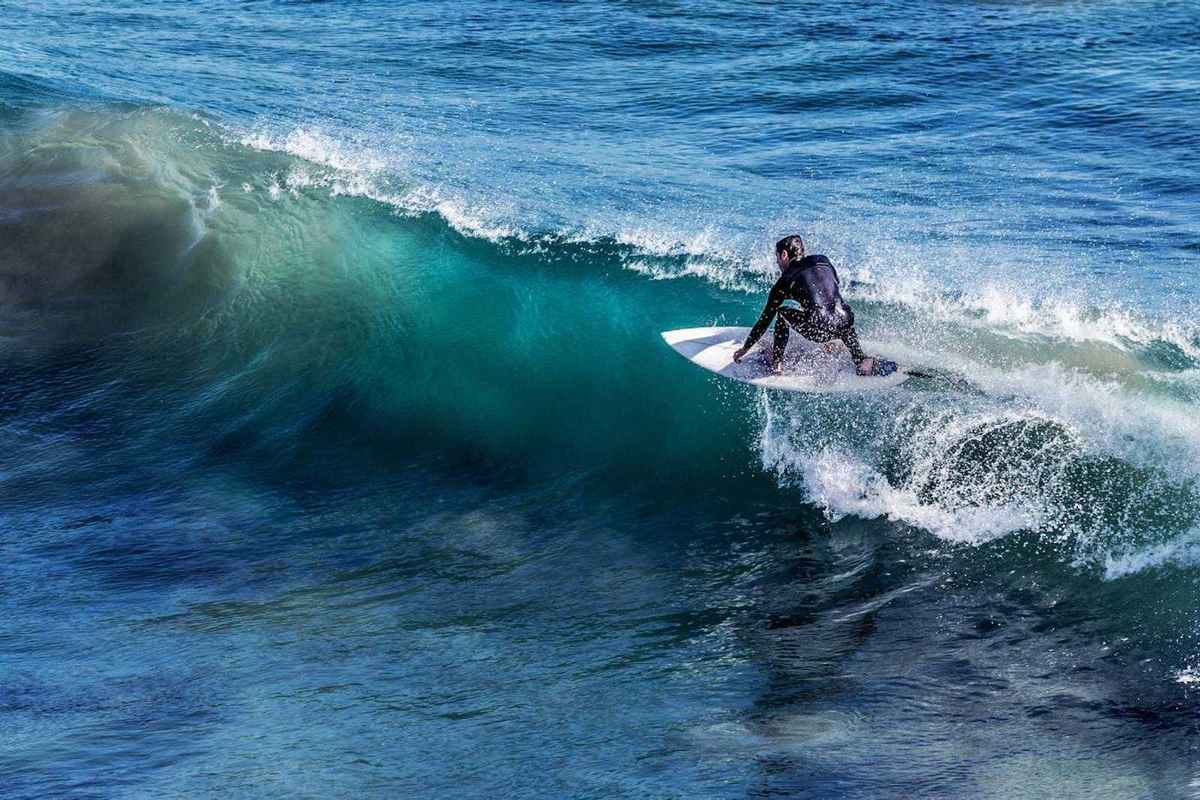 Left-hand wave peeling over coral reef at T-Land, Rote Island